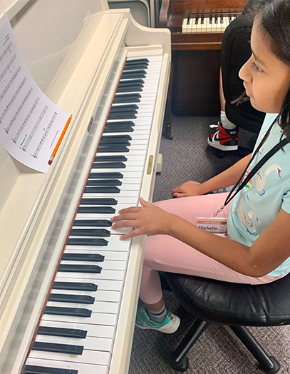 Music summer camp in dunedin location music games happy students having fun piano lessons